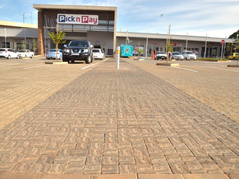dry-pressed flagstone paver and a dry-pressed cobble paver